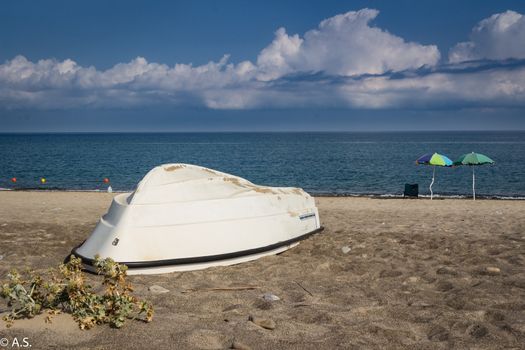 White small boat on the beautiful sicilian beach