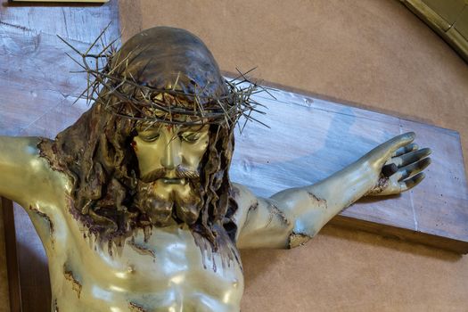 Detail of Christ on the cross in a old church of Sicily