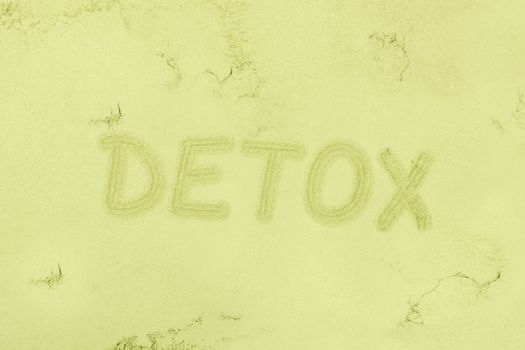 Green detox background. Seamless green ground powder background with the word detox written in it. Green food supplement. Wheatgrass, chlorella and spirulina. Green pills and ground powder. Healthy lifestyle.