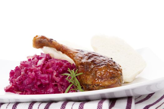 Delicious roast duck with red cabbage and dumplings. Traditional festive eating. 