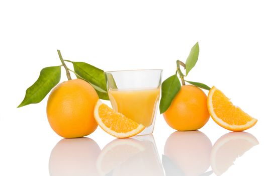 Delicious whole oranges with leaves and slices isolated on white background. Healthy fruit eating. 