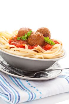 Delicious pasta with tomato sauce and meatballs. Traditional mediterranean eating. 