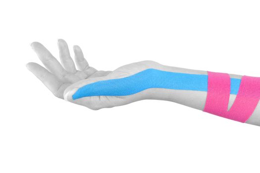 Kinesio tape on female hand isolated on white background. Chronic pain, alternative medicine. Rehabilitation and physiotherapy.