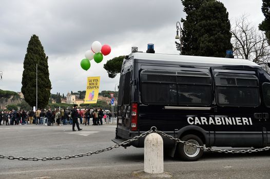 ITALY, Rome: A police van is parked alongside the road as Italians gather in Rome's Circus Maximus arena on January 30, 2016 to protest against a civil unions bill for same-sex couples. The rally's organizers framed the protest as a 'family day' celebration in support of traditional marriage and has been backed by some members of the Catholic church. Lawmakers will vote next week on proposals that will allow gay couples with civil unions, and unmarried heterosexual couples, the same rights as they would have under marriage. Italy is the only nation in Western Europe that does not recognize same sex civil unions or gay marriage. 