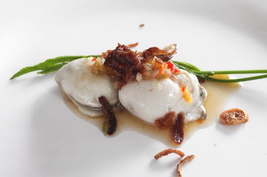 Fresh raw oyster with spicy sauce, thai style seafood