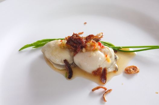 Fresh raw oyster with spicy sauce, thai style seafood