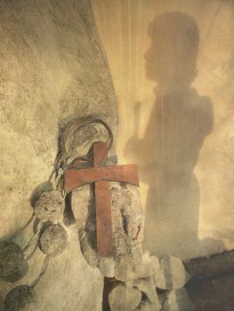 Detail of cross from the statue Sancta Birgitta outside the monastery in Vadstena Sweden.