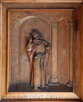 Relief on the door of the church of St. Martin in Portofino, Italy