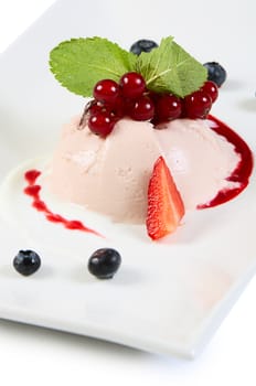 The creamy souffle with berries close up