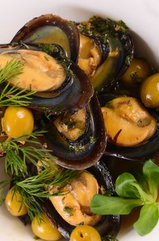 Mussels in the shell with sauce close-up
