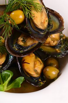 Mussels in the shell with sauce close-up