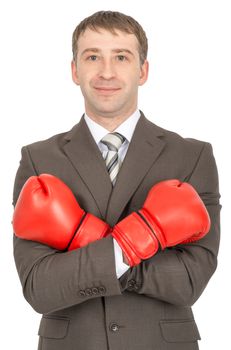 Smiling businessman with crossed arms in red boxing gloves  isolated on white background
