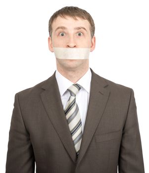 Scared businessman with tape over his mouth isolated on white background