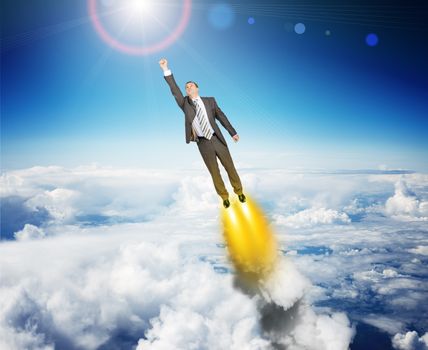 Businessman in suit flying above sky with clouds