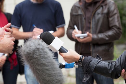 Press interview. News conference. Reporters.