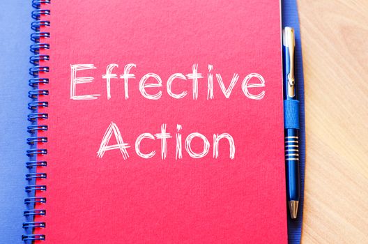 Effective action text concept write on notebook with pen