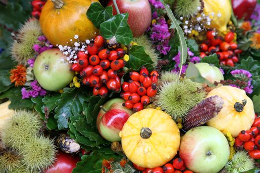 Fall arrangement with fruits and flowers