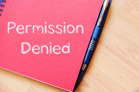 Permission denied text concept write on notebook with pen