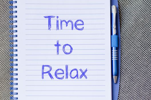 Time to relax text concept write on notebook with pen