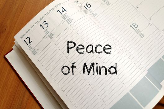 Peace of mind text concept write on notebook with pen