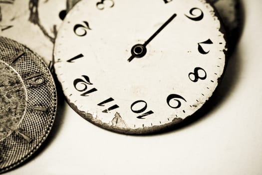 Horizontal high contrast top view of a set broken hand watches 