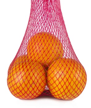 Pack of four oranges in a nylon bag isolated on white background