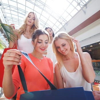 beautiful young women shopping at mall