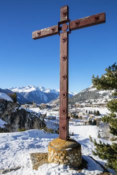 View of cross and Aussois village, France
