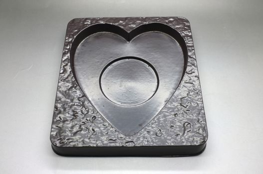 Empty plastic tray in heart shape