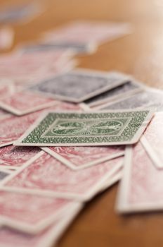 Deck of Cards spread out acrossed a table before a poker game