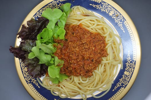 Spaghetti Bolognese, meat tomato sauce with lettuce