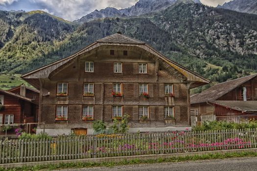 Guttannen, Switzerland, chalet brown and wood and sky