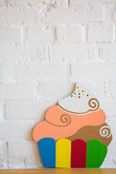 colored cake handmade of cardboar on white background