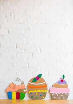 colored cakes handmade of cardboar on white background