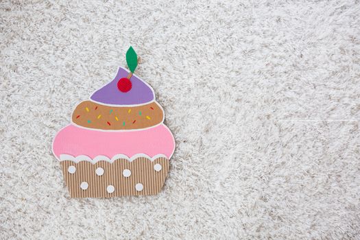 colored cake handmade of cardboar on white background