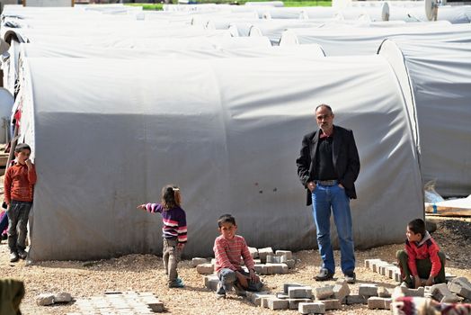 Unnamed  syrian (kurdish) people in refugee camp in Suruc. These people are refugees from Kobane and escaped because of Islamic state attack. March 30, 2015; Suruc, Turkey