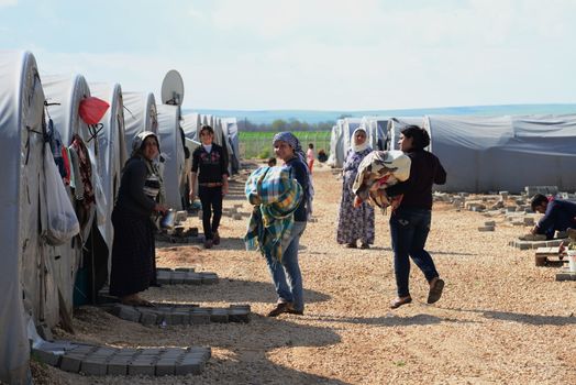 Unnamed  syrian (kurdish) people in refugee camp in Suruc. These people are refugees from Kobane and escaped because of Islamic state attack. March 30, 2015; Suruc, Turkey