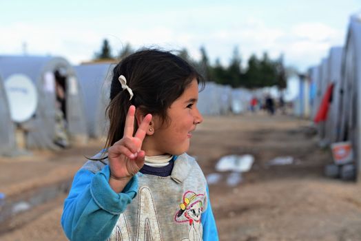 Unnamed  syrian people in unofficial refugee camp in Reayhanli. These people are refugees from Syria and escaped because of long civil war. April 1, 2015; Reyhanli, Turkey