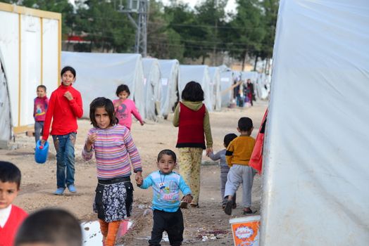 Unnamed  syrian (kurdish) people in refugee camp in Suruc. These people are refugees from Kobane and escaped because of Islamic state attack. April 3, 2015; Suruc, Turkey