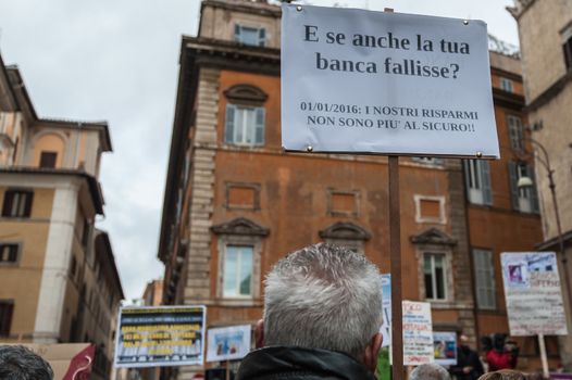 ITALY, Rome: As Italy's economy struggles in the face of a banking crisis, protesters fill the Piazza Santi Apostoli in Rome on January 31, 2016. They voice their fears about the state of their savings.Sign reads: And if your bank fails? Our savings are no longer safe.