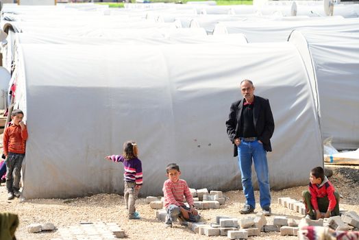 Syrian people in refugee camp in Suruc. These people are refugees from Kobane and escaped because of Islamic state attack. 30.3.2015, Suruc, Turkey