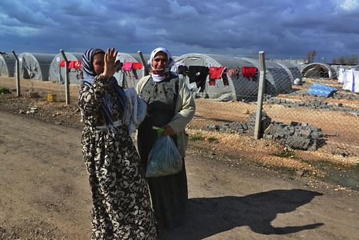 Syrian people in refugee camp in Suruc. These people are refugees from Kobane and escaped because of Islamic state attack. 30.3.2015, Suruc, Turkey