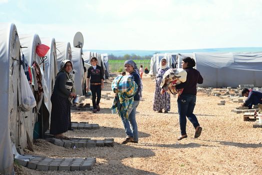 Syrian people in refugee camp in Suruc. These people are refugees from Kobane and escaped because of Islamic state attack. 30.3.2015, Suruc, Turkey