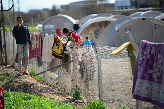 Syrian people in refugee camp in Suruc. These people are refugees from Kobane and escaped because of Islamic state attack. 30.3.2015, Suruc, Turkey