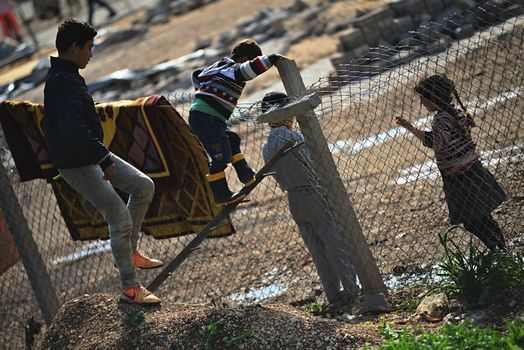 Syrian people in refugee camp in Suruc. These people are refugees from Kobane and escaped because of Islamic state attack. 30.3.2015, Suruc, Turkey