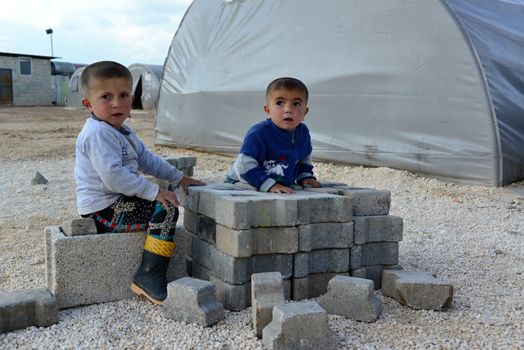 Syrian people in refugee camp in Suruc. These people are refugees from Kobane and escaped because of Islamic state attack. 3.4.2015, Suruc, Turkey