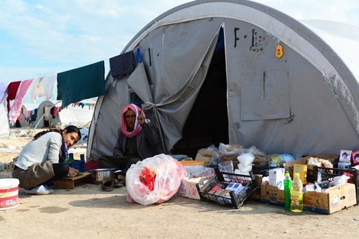 Syrian people in refugee camp in Suruc. These people are refugees from Kobane and escaped because of Islamic state attack. 3.4.2015, Suruc, Turkey