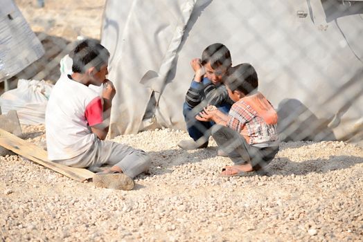 Syrian people in refugee camp in Suruc. These people are refugees from Kobane and escaped because of Islamic state attack. 3.4.2015, Suruc, Turkey