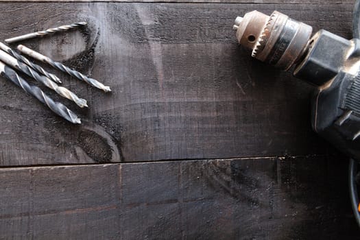 Still life containing several tools in dark wood background