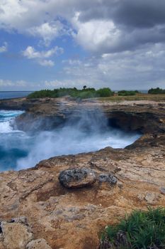 Surf in the rocks near the island of Lembongan Bali, Indonesia